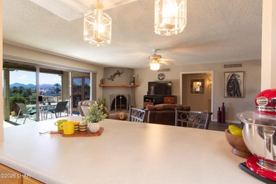 The spacious open floor plan allows you to enjoy the green on London Bridge Golf Course in Arizona - for sale on GolfHomes.com, golf home, golf lot