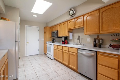 The spacious open floor plan allows you to enjoy the green on London Bridge Golf Course in Arizona - for sale on GolfHomes.com, golf home, golf lot