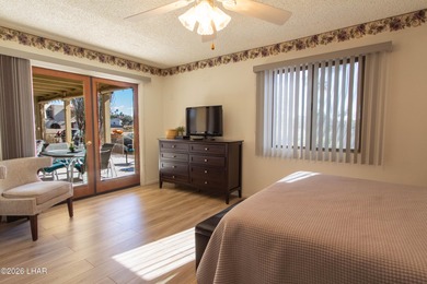 The spacious open floor plan allows you to enjoy the green on London Bridge Golf Course in Arizona - for sale on GolfHomes.com, golf home, golf lot