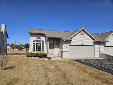 Showings begin 3/15. Beautiful kitchen with solid surface on Saddle Ridge Golf Club in Wisconsin - for sale on GolfHomes.com, golf home, golf lot