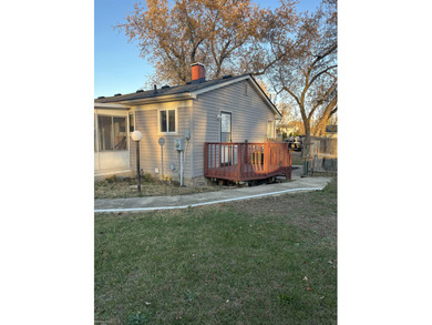 Welcome home to this charming 3-bedroom residence nestled in a on Lake Erie Metropark Golf Course in Michigan - for sale on GolfHomes.com, golf home, golf lot