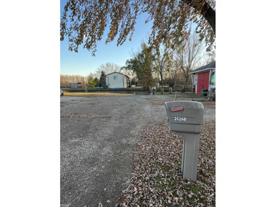Welcome home to this charming 3-bedroom residence nestled in a on Lake Erie Metropark Golf Course in Michigan - for sale on GolfHomes.com, golf home, golf lot