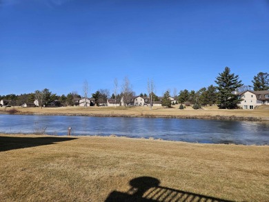 Showings begin 3/15. Beautiful kitchen with solid surface on Saddle Ridge Golf Club in Wisconsin - for sale on GolfHomes.com, golf home, golf lot