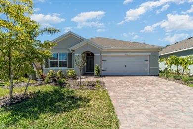 Picture this: a spacious lot with a stunning view of a wooded on Herons Glen Golf and Country Club in Florida - for sale on GolfHomes.com, golf home, golf lot