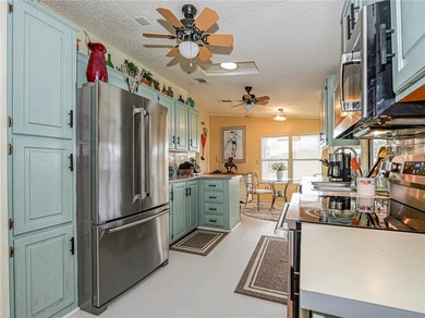 Clean! Fresh updates New Appliances, New AC, Ceiling fans, paint on Barefoot Bay Golf Course in Florida - for sale on GolfHomes.com, golf home, golf lot