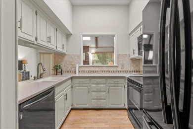 Welcome to this spacious 2-bedroom, 2-bath townhome perfectly on Leawood South Country Club in Kansas - for sale on GolfHomes.com, golf home, golf lot