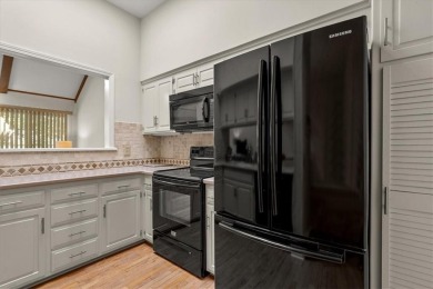 Welcome to this spacious 2-bedroom, 2-bath townhome perfectly on Leawood South Country Club in Kansas - for sale on GolfHomes.com, golf home, golf lot