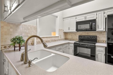 Welcome to this spacious 2-bedroom, 2-bath townhome perfectly on Leawood South Country Club in Kansas - for sale on GolfHomes.com, golf home, golf lot
