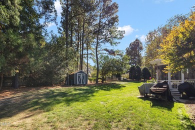 5BR / 4BA on Corner Lot with Double Porches, Screened Porch & on Heritage Golf Club in North Carolina - for sale on GolfHomes.com, golf home, golf lot