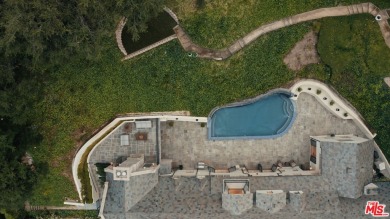 Experience unparalleled luxury at this magnificent English Manor on Bel-Air Country Club in California - for sale on GolfHomes.com, golf home, golf lot