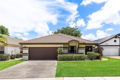 Located in the prestigious Boca Woods Country Club, this updated on Boca Woods Country Club in Florida - for sale on GolfHomes.com, golf home, golf lot