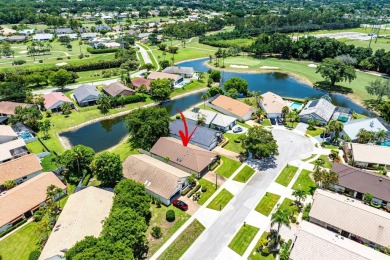 Located in the prestigious Boca Woods Country Club, this updated on Boca Woods Country Club in Florida - for sale on GolfHomes.com, golf home, golf lot