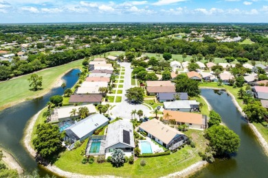 Located in the prestigious Boca Woods Country Club, this updated on Boca Woods Country Club in Florida - for sale on GolfHomes.com, golf home, golf lot