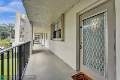 Beautiful condo in Pine Island Ridge's Poinciana community with on Pine Island Ridge Country Club in Florida - for sale on GolfHomes.com, golf home, golf lot