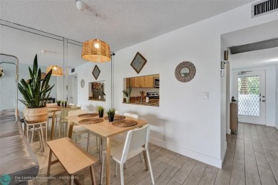 Beautiful condo in Pine Island Ridge's Poinciana community with on Pine Island Ridge Country Club in Florida - for sale on GolfHomes.com, golf home, golf lot