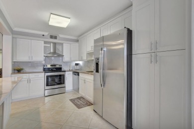 This stunning first-floor condo offers a spacious and modern on Boca Pointe Country Club in Florida - for sale on GolfHomes.com, golf home, golf lot