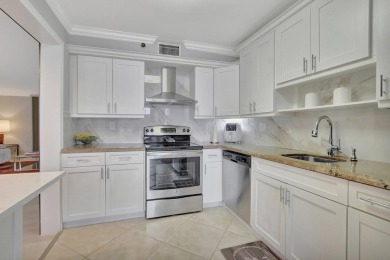 This stunning first-floor condo offers a spacious and modern on Boca Pointe Country Club in Florida - for sale on GolfHomes.com, golf home, golf lot