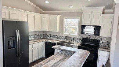 Discover this charming 1-bedroom, 1-bath Country Cottage by on Links At Lands End in Texas - for sale on GolfHomes.com, golf home, golf lot
