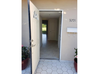 This spacious and beautiful end unit townhome has recently been on Palm-Aire Country Club and Resort - Palms in Florida - for sale on GolfHomes.com, golf home, golf lot