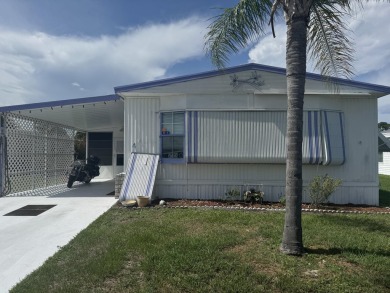 Check out this cute 2 BED 2 BATH double wide home in Spanish on Spanish Lakes Golf Village in Florida - for sale on GolfHomes.com, golf home, golf lot