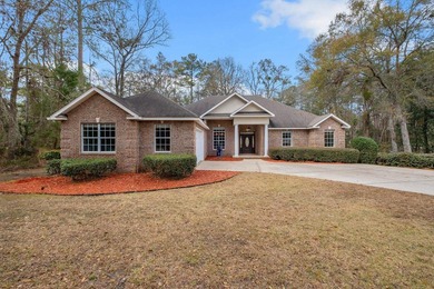 All-brick residential home located at 2250 Cobb Drive within the on Golden Eagle Country Club in Florida - for sale on GolfHomes.com, golf home, golf lot