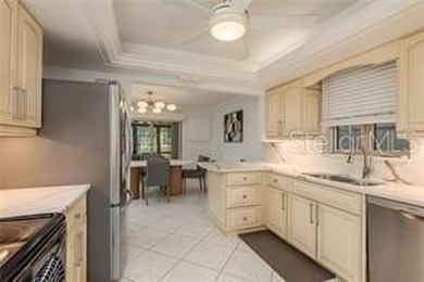 Welcome to your DREAM VILLA nestled in the sought after on Tarpon Woods Golf Club in Florida - for sale on GolfHomes.com, golf home, golf lot