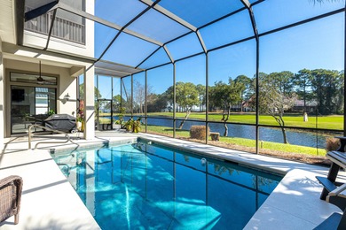 Tucked away within the highly sought-after-gated community of on Emerald Bay Golf Club in Florida - for sale on GolfHomes.com, golf home, golf lot