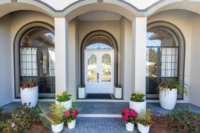 Tucked away within the highly sought-after-gated community of on Emerald Bay Golf Club in Florida - for sale on GolfHomes.com, golf home, golf lot
