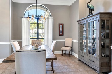 Tucked away within the highly sought-after-gated community of on Emerald Bay Golf Club in Florida - for sale on GolfHomes.com, golf home, golf lot