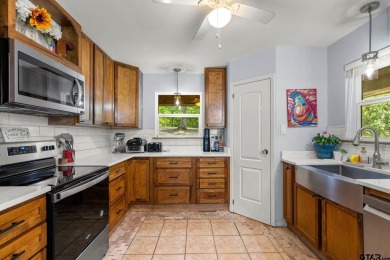 Secluded 3 bedroom 2 bath home surrounded on all 4 sides by on Holly Lake Ranch Golf Club in Texas - for sale on GolfHomes.com, golf home, golf lot