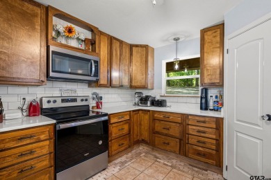 Secluded 3 bedroom 2 bath home surrounded on all 4 sides by on Holly Lake Ranch Golf Club in Texas - for sale on GolfHomes.com, golf home, golf lot
