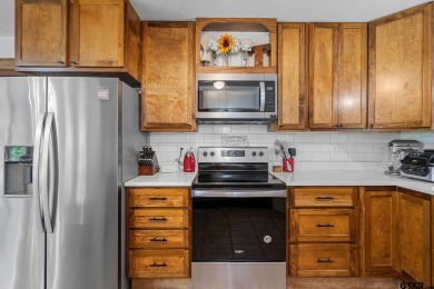 Secluded 3 bedroom 2 bath home surrounded on all 4 sides by on Holly Lake Ranch Golf Club in Texas - for sale on GolfHomes.com, golf home, golf lot