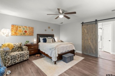 Secluded 3 bedroom 2 bath home surrounded on all 4 sides by on Holly Lake Ranch Golf Club in Texas - for sale on GolfHomes.com, golf home, golf lot