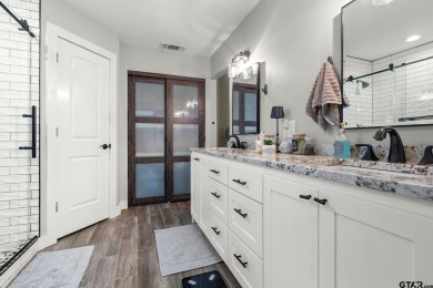 Secluded 3 bedroom 2 bath home surrounded on all 4 sides by on Holly Lake Ranch Golf Club in Texas - for sale on GolfHomes.com, golf home, golf lot