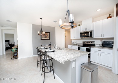 Immaculate 2023 Cali Model in Halifax Plantation. Smart home on Halifax Plantation Golf Club in Florida - for sale on GolfHomes.com, golf home, golf lot