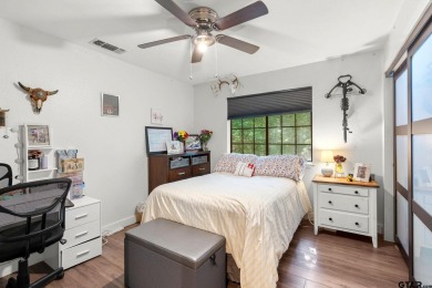 Secluded 3 bedroom 2 bath home surrounded on all 4 sides by on Holly Lake Ranch Golf Club in Texas - for sale on GolfHomes.com, golf home, golf lot