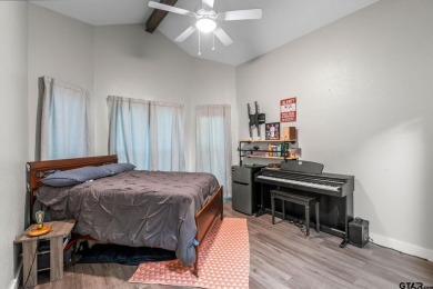 Secluded 3 bedroom 2 bath home surrounded on all 4 sides by on Holly Lake Ranch Golf Club in Texas - for sale on GolfHomes.com, golf home, golf lot