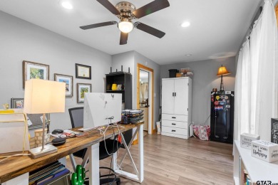 Secluded 3 bedroom 2 bath home surrounded on all 4 sides by on Holly Lake Ranch Golf Club in Texas - for sale on GolfHomes.com, golf home, golf lot