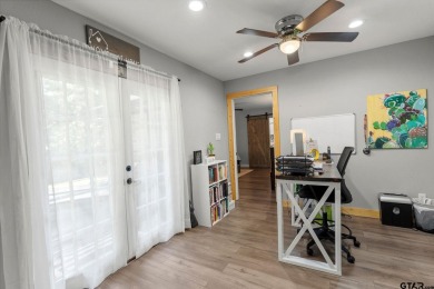 Secluded 3 bedroom 2 bath home surrounded on all 4 sides by on Holly Lake Ranch Golf Club in Texas - for sale on GolfHomes.com, golf home, golf lot