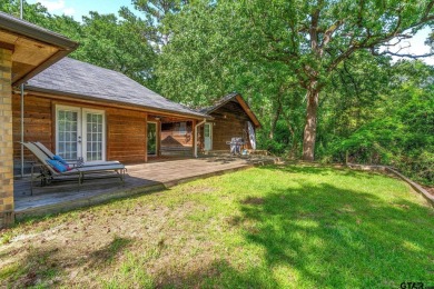 Secluded 3 bedroom 2 bath home surrounded on all 4 sides by on Holly Lake Ranch Golf Club in Texas - for sale on GolfHomes.com, golf home, golf lot
