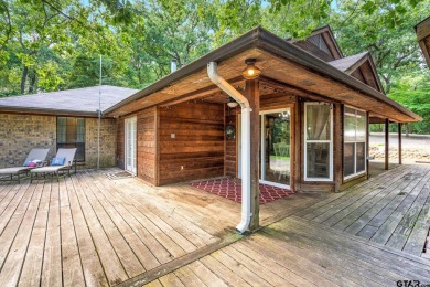 Secluded 3 bedroom 2 bath home surrounded on all 4 sides by on Holly Lake Ranch Golf Club in Texas - for sale on GolfHomes.com, golf home, golf lot