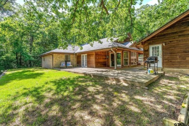 Secluded 3 bedroom 2 bath home surrounded on all 4 sides by on Holly Lake Ranch Golf Club in Texas - for sale on GolfHomes.com, golf home, golf lot