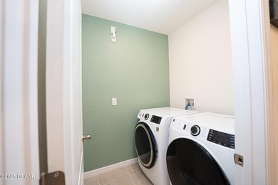 Immaculate 2023 Cali Model in Halifax Plantation. Smart home on Halifax Plantation Golf Club in Florida - for sale on GolfHomes.com, golf home, golf lot