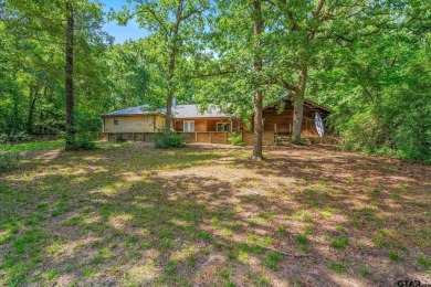Secluded 3 bedroom 2 bath home surrounded on all 4 sides by on Holly Lake Ranch Golf Club in Texas - for sale on GolfHomes.com, golf home, golf lot