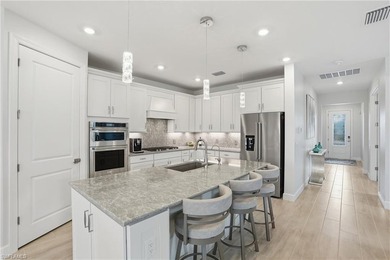 Located on a private cul-de-sac with water view in the highly on Valencia Golf and Country Club in Florida - for sale on GolfHomes.com, golf home, golf lot