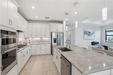 Located on a private cul-de-sac with water view in the highly on Valencia Golf and Country Club in Florida - for sale on GolfHomes.com, golf home, golf lot