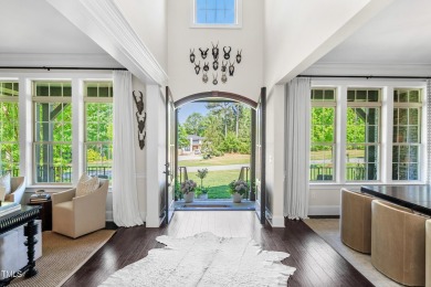 Welcome to this impeccably designed home in the sought-after on Hasentree Club in North Carolina - for sale on GolfHomes.com, golf home, golf lot