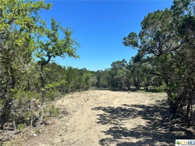 Discover serenity and seclusion in this picturesque flag lot on Canyon Lake Golf Club in Texas - for sale on GolfHomes.com, golf home, golf lot