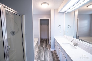 Live lakefront at Leisure Lake, a coveted Foley community where on Glenlakes Golf Club in Alabama - for sale on GolfHomes.com, golf home, golf lot