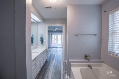 Live lakefront at Leisure Lake, a coveted Foley community where on Glenlakes Golf Club in Alabama - for sale on GolfHomes.com, golf home, golf lot